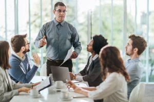 A crisis management consultant speaks to a corporate management team.